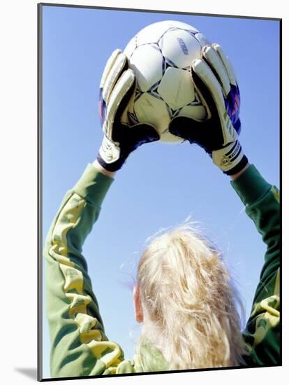 View from Behind of a Girl Holding a Soccer Ball-Steve Cicero-Mounted Photographic Print