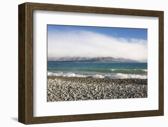 View from rocky shoreline across the stormy waters of Lake Pukaki, near Twizel, Mackenzie district,-Ruth Tomlinson-Framed Photographic Print