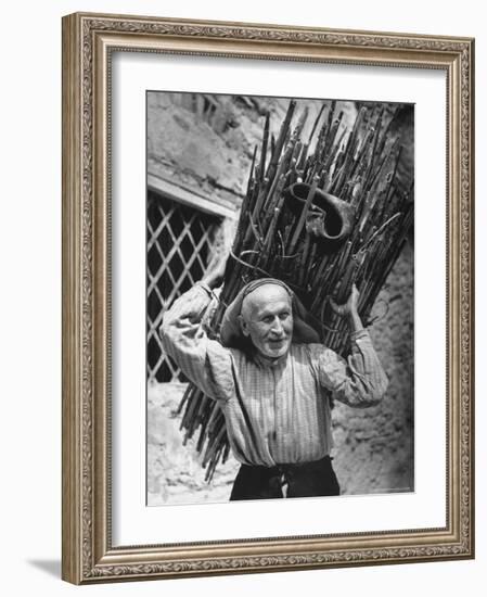 View of a Man Carrying a Big Bundle of Sticks from a Story Concerning Italy-Thomas D^ Mcavoy-Framed Photographic Print