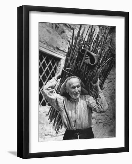 View of a Man Carrying a Big Bundle of Sticks from a Story Concerning Italy-Thomas D^ Mcavoy-Framed Photographic Print