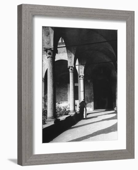 View of a Monk Walking the Grounds of a Church in Milan-Carl Mydans-Framed Photographic Print