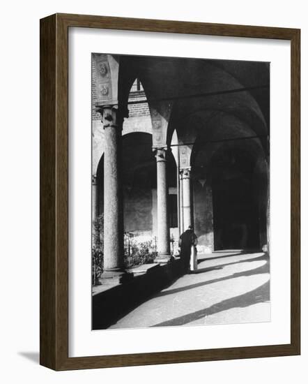 View of a Monk Walking the Grounds of a Church in Milan-Carl Mydans-Framed Photographic Print