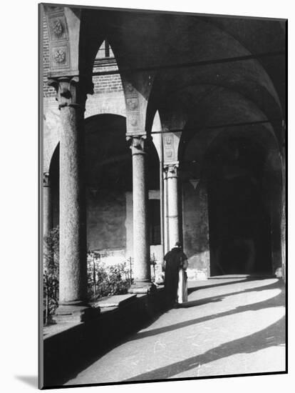 View of a Monk Walking the Grounds of a Church in Milan-Carl Mydans-Mounted Photographic Print