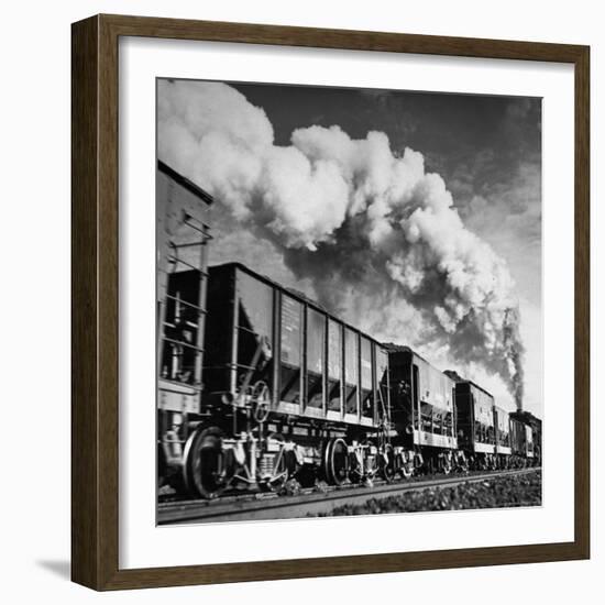 View of a Railcar Loaded with Iron Ore Moving Along the Tracks-Charles E^ Steinheimer-Framed Photographic Print