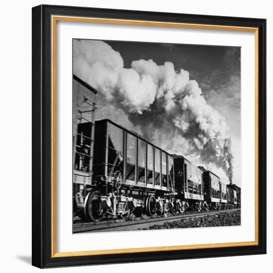 View of a Railcar Loaded with Iron Ore Moving Along the Tracks-Charles E^ Steinheimer-Framed Photographic Print