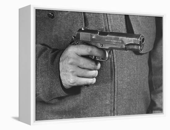 View of a Soldier Holding a US Army Colt Automatic .45 Caliber Pistol-William Vandivert-Framed Premier Image Canvas