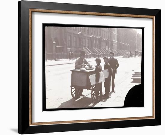 View of an Ice Cream Peddler on the Street, with Three Newsboys Buying Ice Cream, New York, c.1901-Byron Company-Framed Giclee Print