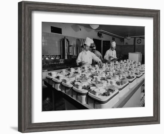 View of Chefs Preparing Food from a Story Concerning United Airlines-Carl Mydans-Framed Photographic Print