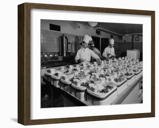 View of Chefs Preparing Food from a Story Concerning United Airlines-Carl Mydans-Framed Photographic Print