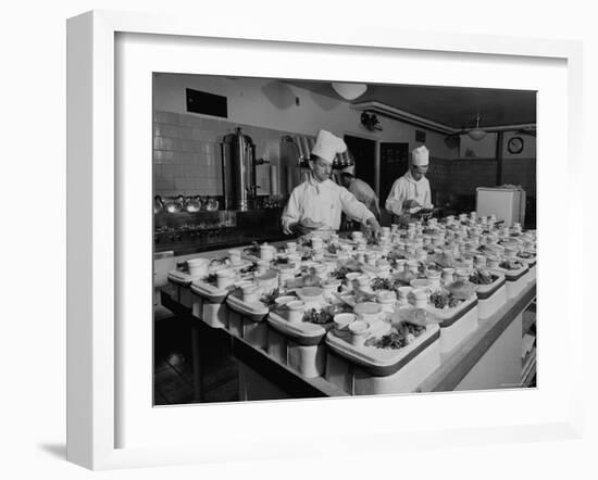 View of Chefs Preparing Food from a Story Concerning United Airlines-Carl Mydans-Framed Photographic Print