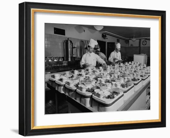 View of Chefs Preparing Food from a Story Concerning United Airlines-Carl Mydans-Framed Photographic Print