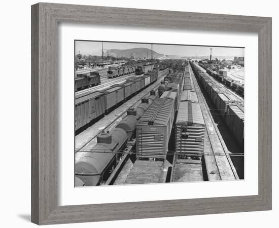 View of Freight Trains, Boxcars and Tank Cars, Standing on Tracks in Small Railroad Yard-null-Framed Photographic Print
