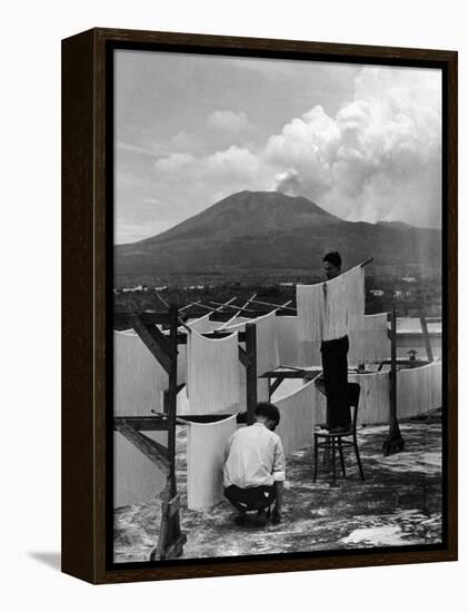 View of Mount Vesuvius from the Town of Torre Annunciata with Men Tending to Drying Pasta-Alfred Eisenstaedt-Framed Premier Image Canvas