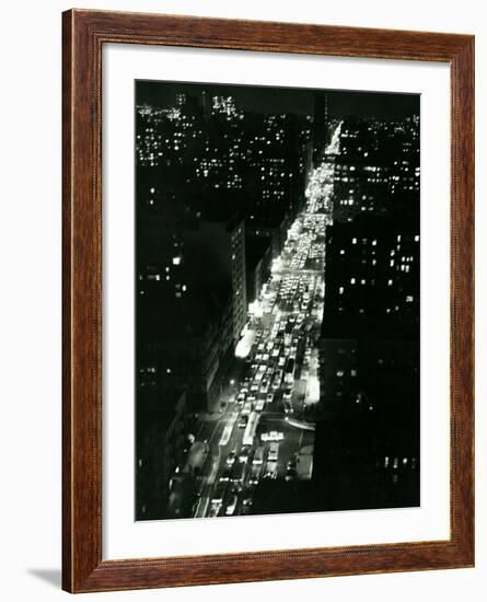 View of New York Illuminated at Night, Traffic Stretches for Miles as Cars Pour into the City-null-Framed Photographic Print