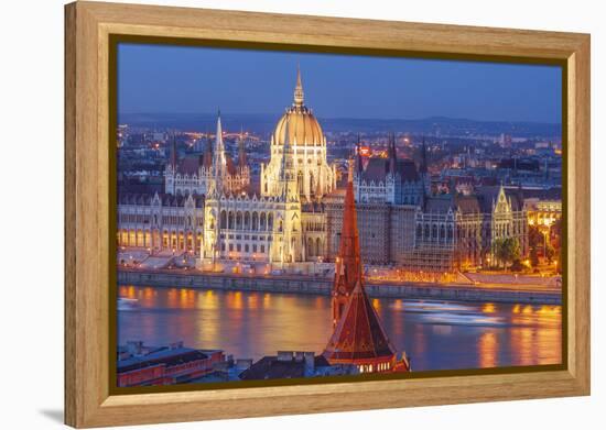 View of Parliament Buildings along Danube River at dusk, Budapest, Capital of Hungary-Tom Haseltine-Framed Premier Image Canvas