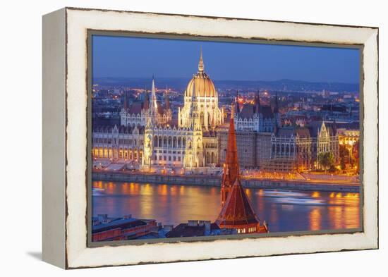 View of Parliament Buildings along Danube River at dusk, Budapest, Capital of Hungary-Tom Haseltine-Framed Premier Image Canvas