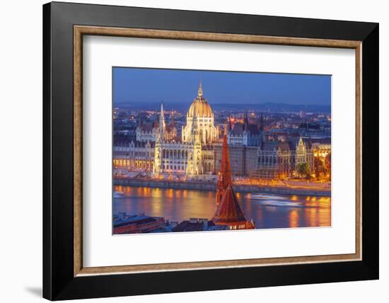 View of Parliament Buildings along Danube River at dusk, Budapest, Capital of Hungary-Tom Haseltine-Framed Photographic Print