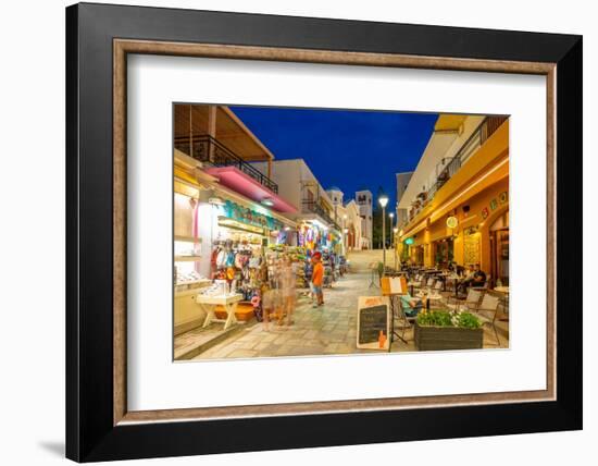 View of shops and restaurants with Church of Agia Paraskevi in the background in Kos Town-Frank Fell-Framed Photographic Print