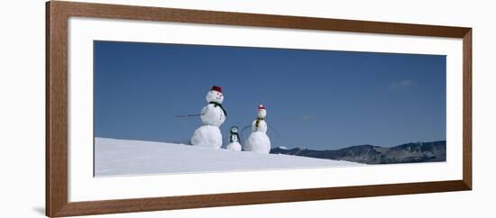 View of Snowmen in Snow Covered Landscape, Waterbury, Vermont, USA-null-Framed Photographic Print