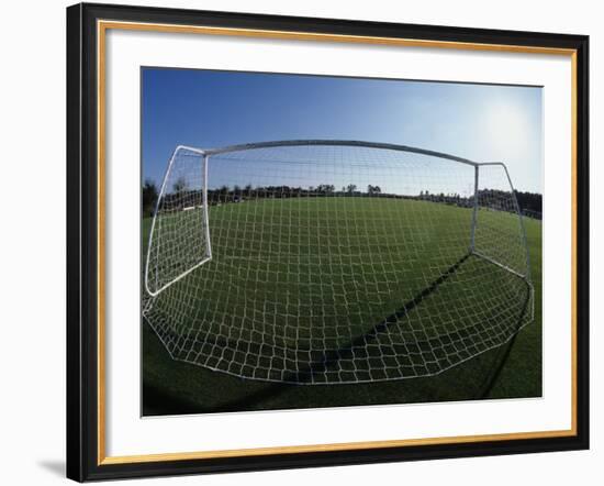 View of Soccer Field Through Goal-Steven Sutton-Framed Photographic Print