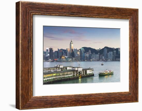 View of Star Ferry Terminal and Hong Kong Island Skyline at Dusk, Hong Kong, China, Asia-Ian Trower-Framed Photographic Print