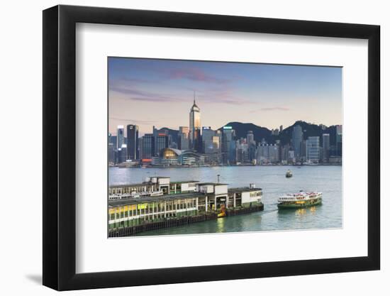 View of Star Ferry Terminal and Hong Kong Island Skyline at Dusk, Hong Kong, China, Asia-Ian Trower-Framed Photographic Print