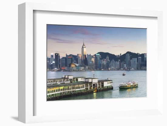 View of Star Ferry Terminal and Hong Kong Island Skyline at Dusk, Hong Kong, China, Asia-Ian Trower-Framed Photographic Print