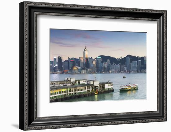 View of Star Ferry Terminal and Hong Kong Island Skyline at Dusk, Hong Kong, China, Asia-Ian Trower-Framed Photographic Print