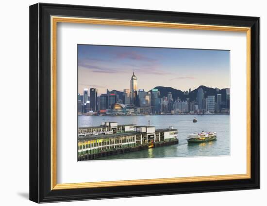 View of Star Ferry Terminal and Hong Kong Island Skyline at Dusk, Hong Kong, China, Asia-Ian Trower-Framed Photographic Print