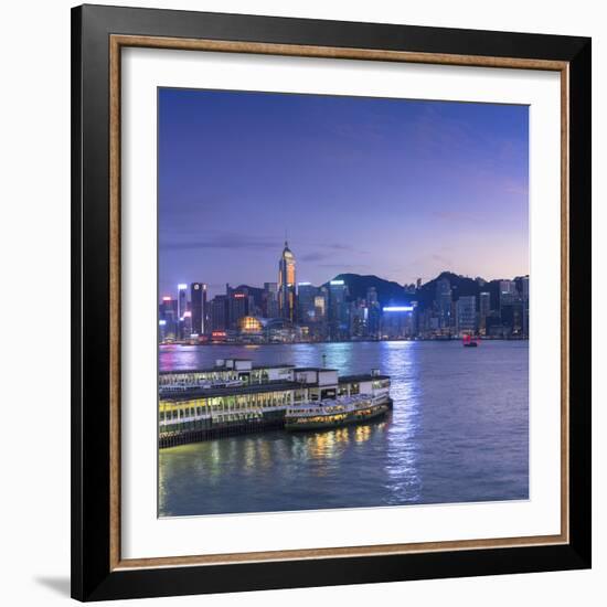 View of Star Ferry Terminal and Hong Kong Island skyline, Hong Kong, China-Ian Trower-Framed Photographic Print