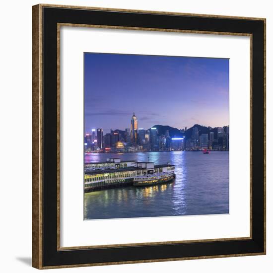 View of Star Ferry Terminal and Hong Kong Island skyline, Hong Kong, China-Ian Trower-Framed Photographic Print