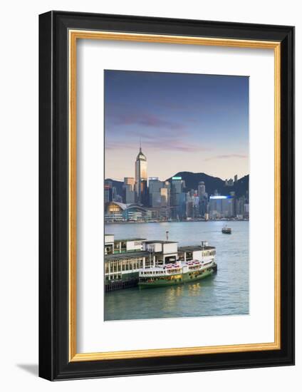 View of Star Ferry Terminal and Hong Kong Island skyline, Hong Kong, China-Ian Trower-Framed Photographic Print