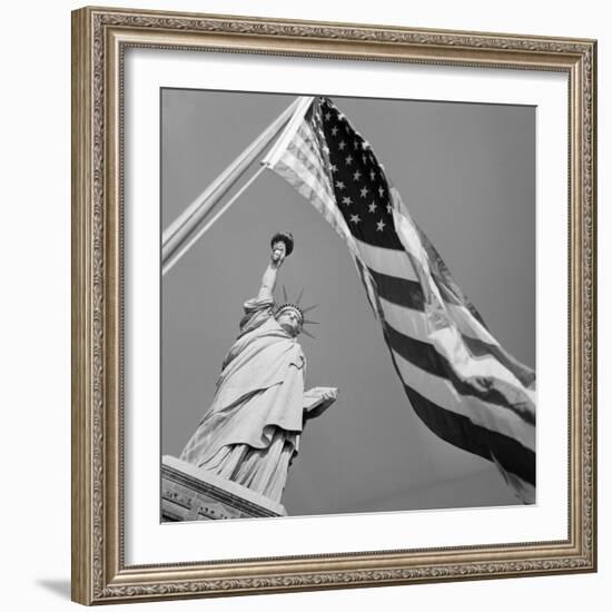 View of Statue of Liberty and American Flag-Bettmann-Framed Photographic Print