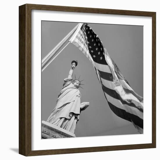 View of Statue of Liberty and American Flag-Bettmann-Framed Photographic Print