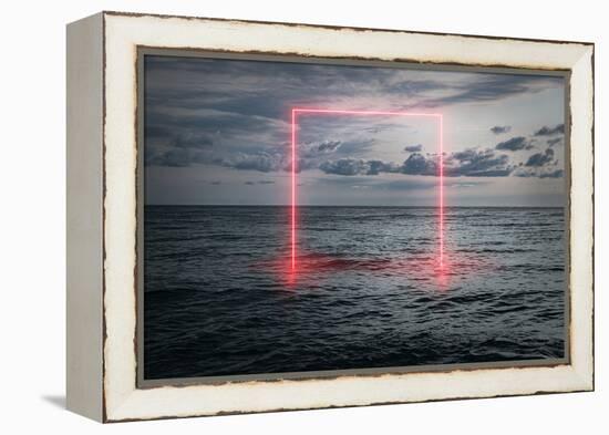 View of the calm sea in the evening, a neon frame emerging from the water, futuristic background-Ekaterina Gertsen-Framed Stretched Canvas