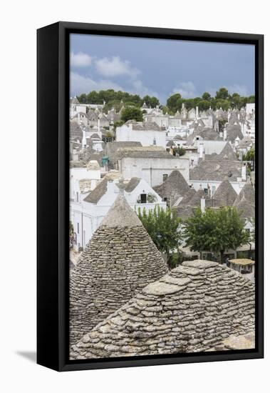 View of the typical Trulli built with dry stone with a conical roof, Alberobello, UNESCO World Heri-Roberto Moiola-Framed Premier Image Canvas