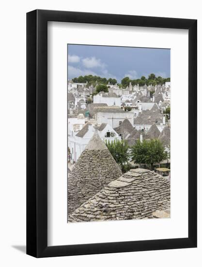 View of the typical Trulli built with dry stone with a conical roof, Alberobello, UNESCO World Heri-Roberto Moiola-Framed Photographic Print