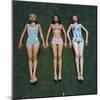 View of Three Unidentified Women in Bathing Suits as They Sunbath on Green Grass, 1961-Allan Grant-Mounted Photographic Print