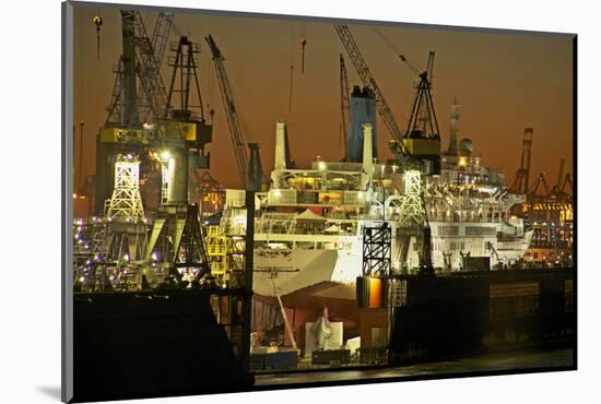 View on the Illuminateded Swimming Docks of Blohm and Voss with Cruise Ship Thomson Celebration-Uwe Steffens-Mounted Photographic Print