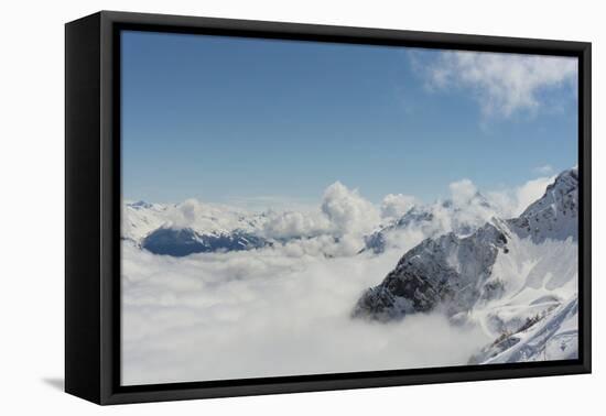 View on Winter Snowy Mountains and Blue Sky above Clouds, Krasnaya Polyana, Sochi, Russia-wasja-Framed Premier Image Canvas