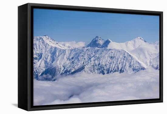 View on Winter Snowy Mountains and Blue Sky above Clouds, Krasnaya Polyana, Sochi, Russia-wasja-Framed Premier Image Canvas