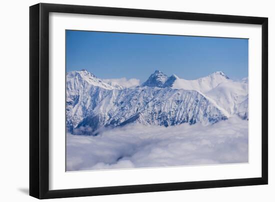 View on Winter Snowy Mountains and Blue Sky above Clouds, Krasnaya Polyana, Sochi, Russia-wasja-Framed Photographic Print