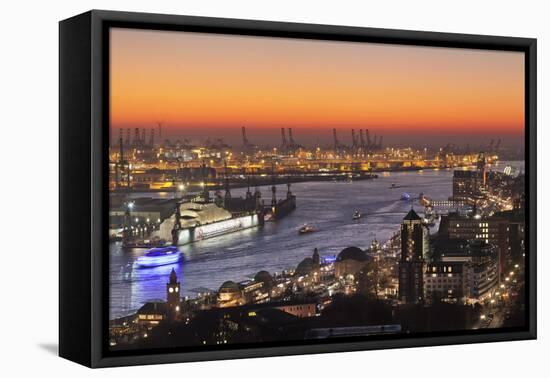 View over St. Pauli district and St. Pauli Landungsbruecken pier over the harbour at sunset, Hambur-Markus Lange-Framed Premier Image Canvas