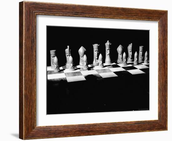 View Showing Chess Pieces with Faces Carved Into Them-David Scherman-Framed Photographic Print