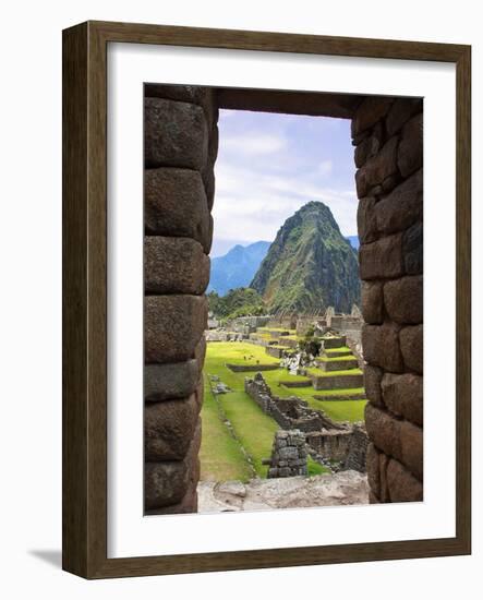 View Through Window of Ancient Lost City of Inca, Machu Picchu, Peru, South America with Llamas-Miva Stock-Framed Photographic Print