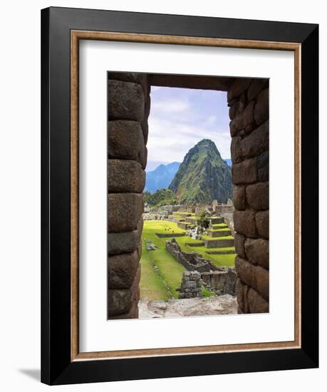 View Through Window of Ancient Lost City of Inca, Machu Picchu, Peru, South America with Llamas-Miva Stock-Framed Photographic Print