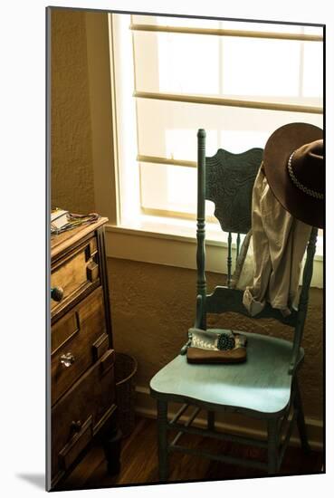 Vignette Of Womans Clothing And Jewelry Draping A Turquoise Chair In A Southwest Home In New Mexico-Hannah Dewey-Mounted Photographic Print