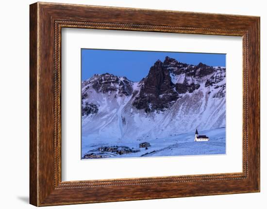 Vik i Myrdal Church, floodlit at twilight after snowfall, Vik, Iceland. December 2017.-Ross Hoddinott-Framed Photographic Print