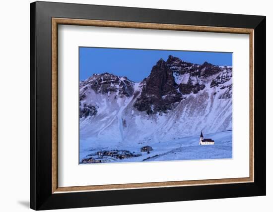 Vik i Myrdal Church, floodlit at twilight after snowfall, Vik, Iceland. December 2017.-Ross Hoddinott-Framed Photographic Print