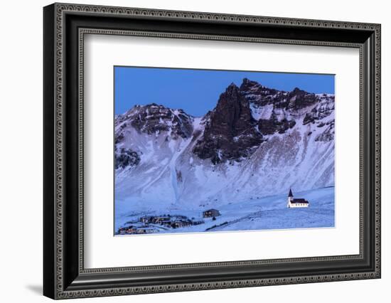 Vik i Myrdal Church, floodlit at twilight after snowfall, Vik, Iceland. December 2017.-Ross Hoddinott-Framed Photographic Print